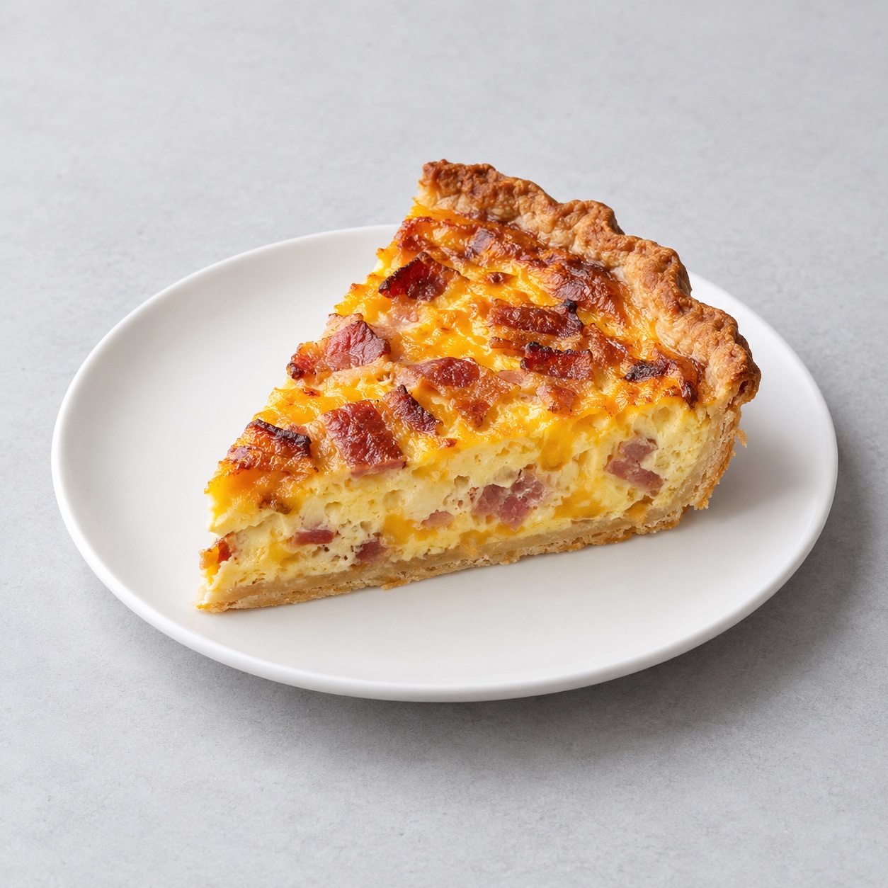 Illustrative Bacon & Cheddar Quiche — approved menu image